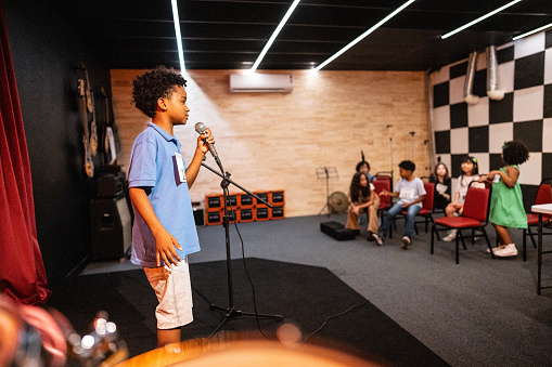 Boy singing in a music contest