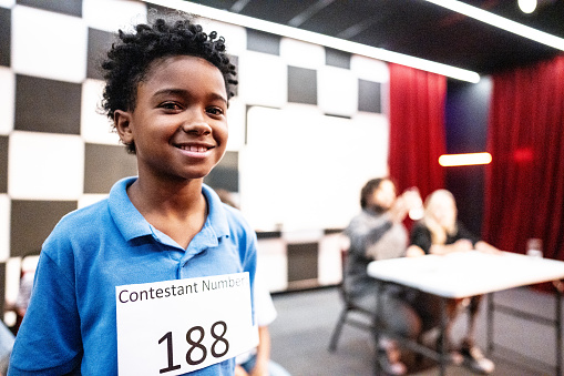 Portrait of a boy with identification number in a music contest