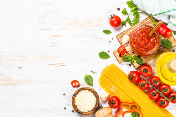istock Italian food background at white bkitchen table. 1667872985