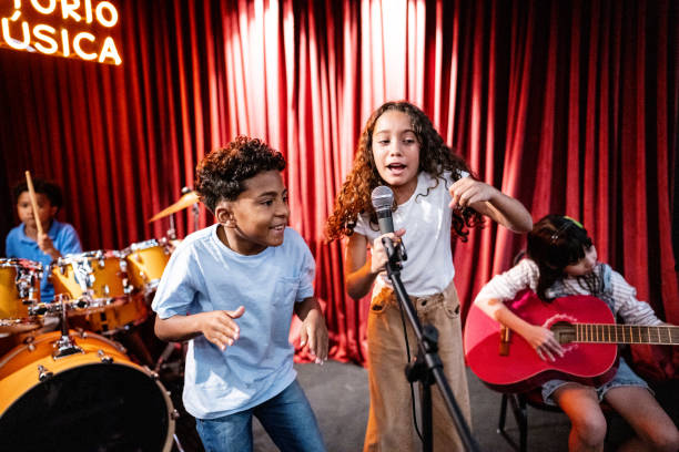 istock Children singing in a music school 1667873560