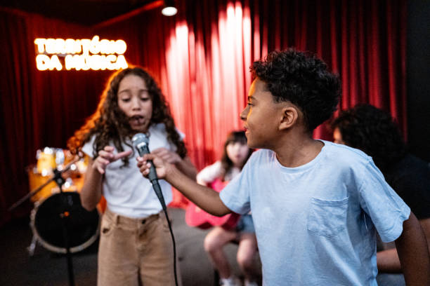 istock Children singing in a music school 1667873636