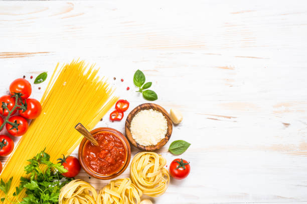 istock Italian food background at white bkitchen table. 1667874156