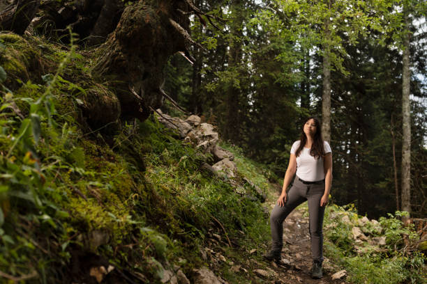 istock Young woman enjoying time in forest 1667874819