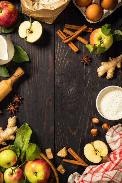 istock Apple pie with ginger and cinnamon at dark wooden table. 1667875462
