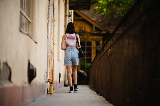 istock Young woman walking 1667949364