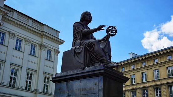 Monument to Nicolaus Copernicus in the center of Warsaw next to the Polish Academy of Sciences. Warsaw, Masovian Voivodeship, Poland - July 22, 2023.