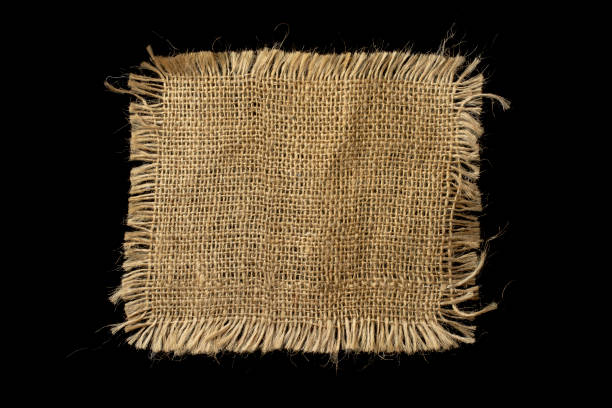 istock Piece of linen fabric isolated on a black background. 1667980107