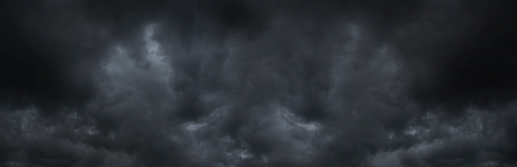 Banner Dramatic dark storm clouds black sky background. Dark thunderstorm clouds rainny season. Panorama Meteorology danger windstorm disasters climate. Dark cloudscape storm cloud with copy space.