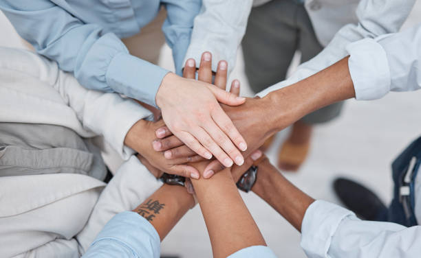 istock Hands stack, group teamwork and business people celebrate corporate society goals, synergy or agency meeting. Top view, collaboration and closeup team building support, mission motivation or trust 1667993947