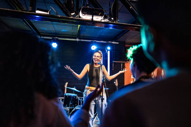 Young woman talking during stand-up comedy show