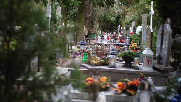 istock Walking on Cemetery Between Gravestones Crosses and Trees 1668007625