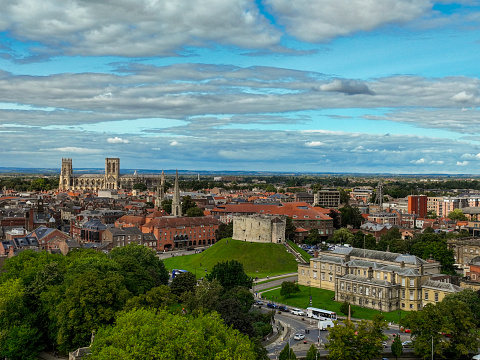 defaultAn aerial Photograph of York Minster, Clifford’s Tower Castle and York Crown Court buildings in York, North Yorkshire, England. The photograph was produced on a bright sunny afternoon.