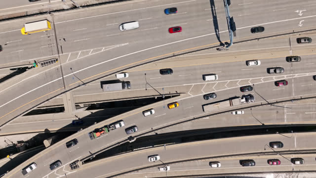 Traffic on Crisscrossing Freeway Ramps - Static Top Down Aerial Shot