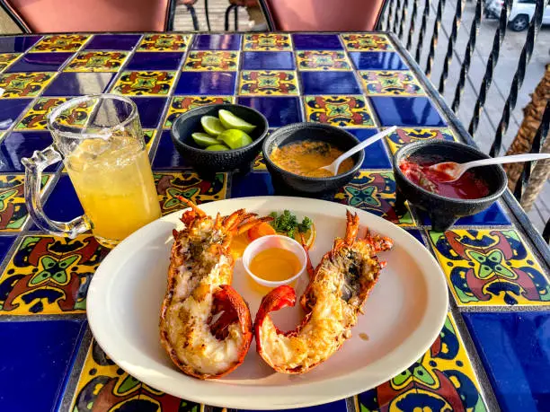Photo of The famous lobster from the fishing village of Puerto Nuevo in Mexico, where they prepare this tasty lobster in a traditional style, fresh from the Pacific Ocean.