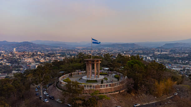 aerial view of tegucigalpa with honduras' national flag - tegucigalpa imagens e fotografias de stock