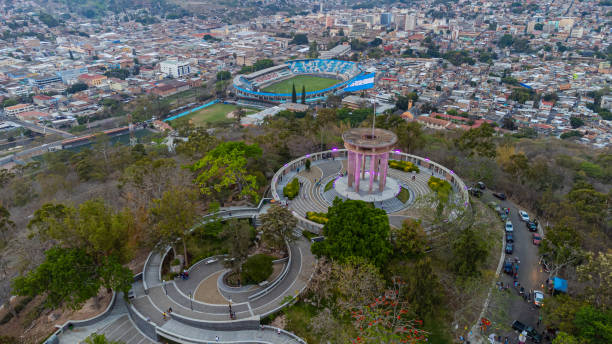 aerial view of tegucigalpa with honduras' national flag - tegucigalpa imagens e fotografias de stock