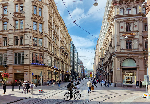 Helsinki, Finland - 8/26/2023: A view of Helsinki downtown with shoppers, taken at the intersection of Aleksanterinkatu & Mikonkatu