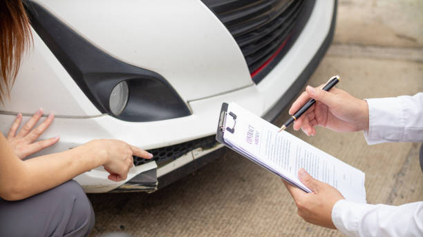 istock Insurance agents meet with customers when accidents occur to inspect damage and document insurance claims expeditiously. concept of car insurance agents to urgently inspect damage for customers. 1668070657
