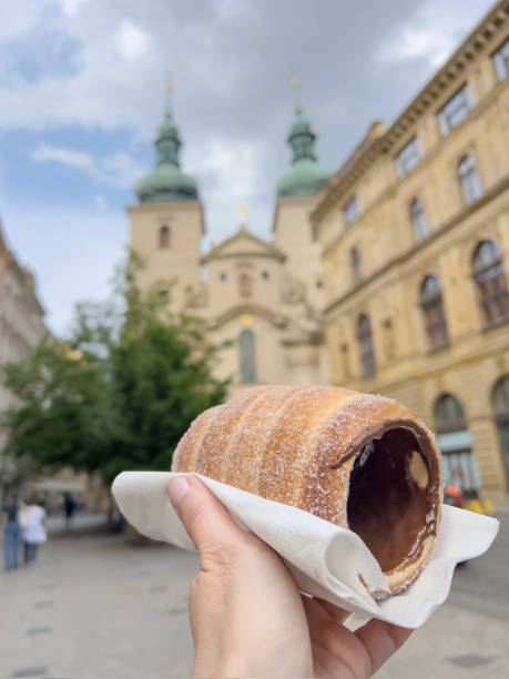 istock hand holds traditional dessert in Prague, Czechia 1668094500