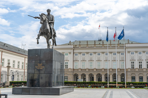 Presidential Palace in Warsaw. Jozel Poniatowski Sculpture. Flag NATO Poland, Warsaw - July 27, 2023