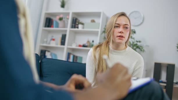 istock Victim of aggression talking about her problems to a professional psychologist, mental trauma 1668128296