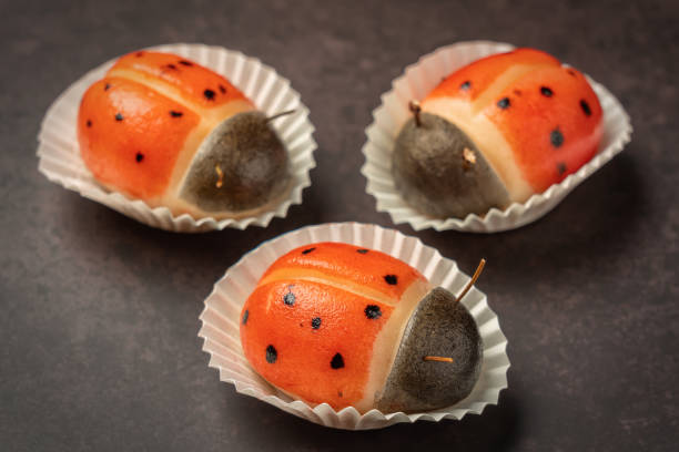 Portuguese marzipan delicacy in the shape of ladybug. Gourmet sweets from Algarve Portugal on a marble background close-up. stock photo