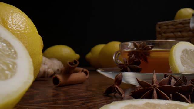 Star Anise Fruits, Sliced Lemon, Cinnamon Bark And Ginger - Healthy Tea. - closeup, pullback