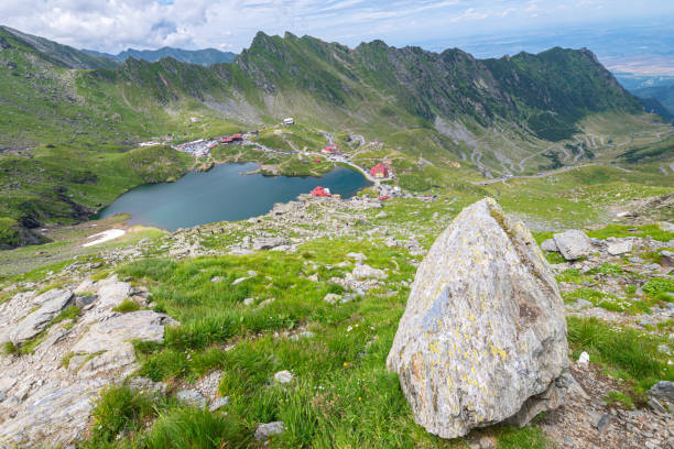 Scenic view of Lake Balea in the southern Carpathians, Romania Picturesque view from above of Bâlea Lake in Făgăraș Mountains, Romania. balea lake romania stock pictures, royalty-free photos & images