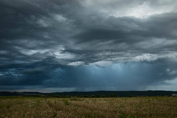 istock Heavy rain and hail falls from a thunderstorm over the plains 1668212286