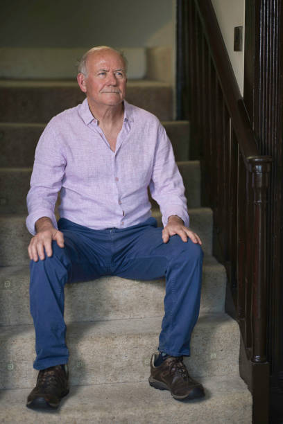 istock Elderly man resting on the stairs 1668227792