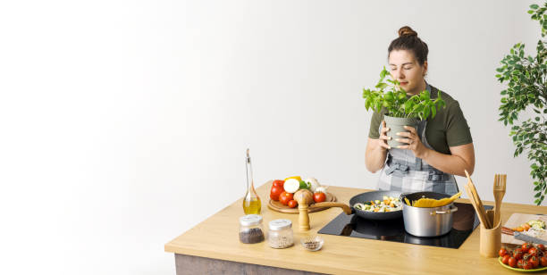 istock Woman cooking pasta with fresh vegetables 1668238754