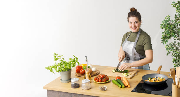 istock Female cook preparing a meal 1668239272