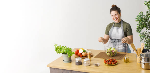 istock Woman preparing a fresh salad 1668240839