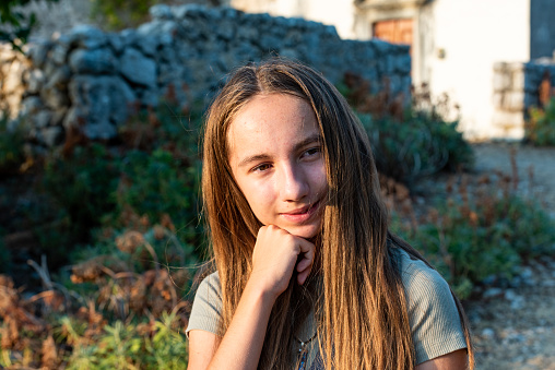 Portrait of Teenage Girl  Exploring Old Ruins on Vacation in Croatia