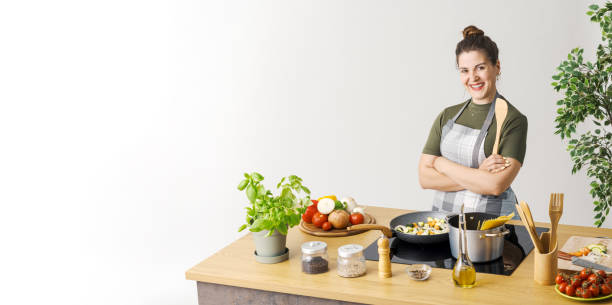 istock Woman cooking pasta with fresh vegetables 1668246256
