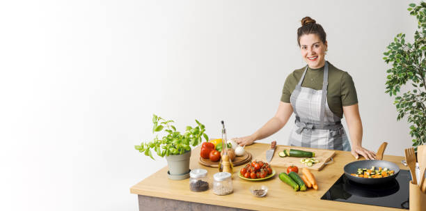istock Female cook preparing a meal 1668246810