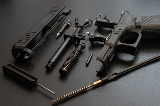 Gun disassembled for cleaning, close up photo