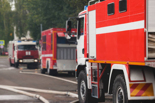 istock Fire fighting equipment in the city, with red fire engine truck during fire fighting operation in the city streets, vehicle and firefighters extinguish blaze, emergency and rescue service vehicle 1668262786
