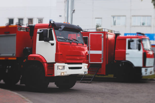 istock Fire fighting equipment in the city, with red fire engine truck during fire fighting operation in the city streets, vehicle and firefighters extinguish blaze, emergency and rescue service vehicle 1668263036