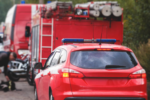istock Fire fighting equipment in the city, with red fire engine truck during fire fighting operation in the city streets, vehicle and firefighters extinguish blaze, emergency and rescue service vehicle 1668263172