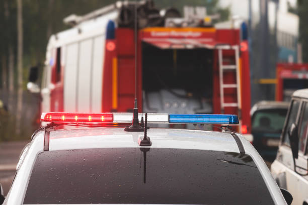 istock Fire fighting equipment in the city, with red fire engine truck during fire fighting operation in the city streets, vehicle and firefighters extinguish blaze, emergency and rescue service vehicle 1668263316