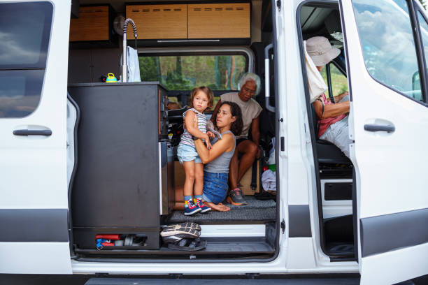 istock Multigenerational family in camper van getting ready for a hike 1668284866