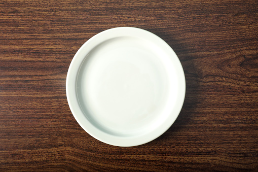 Single empty plate on table