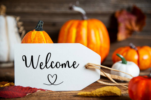istock Orange Pumpkin Decoration With Label With Text Welcome 1668299558