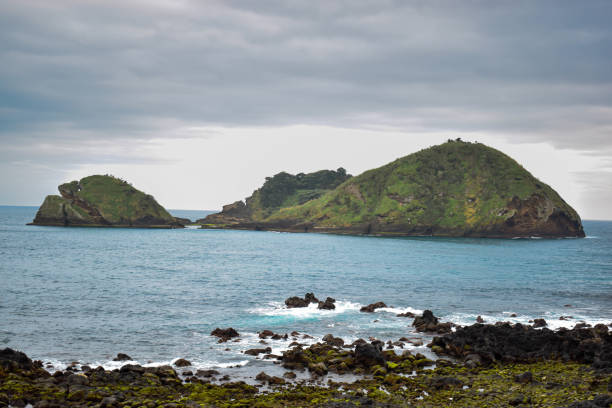 istock Small island seen from the seashore 1668300068