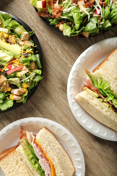 istock Group of green salad bowls and sandwich plates 1668302683