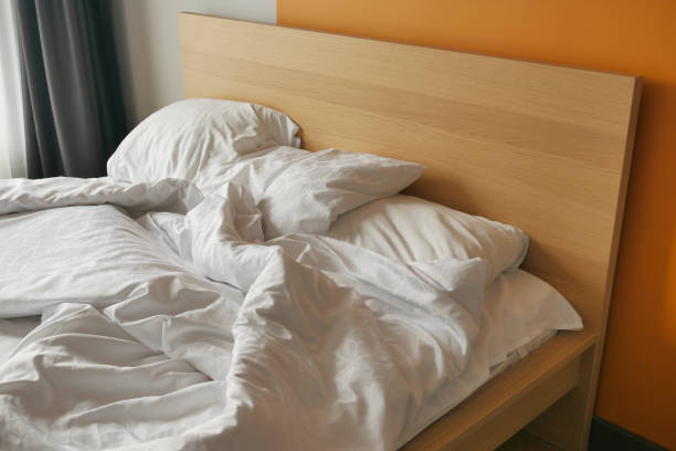 istock messy bed in early morning , messy bed after waking up 1668327365