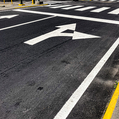 Traffic sign on the freshly painted asphalt in a suburb of the city of Caracas