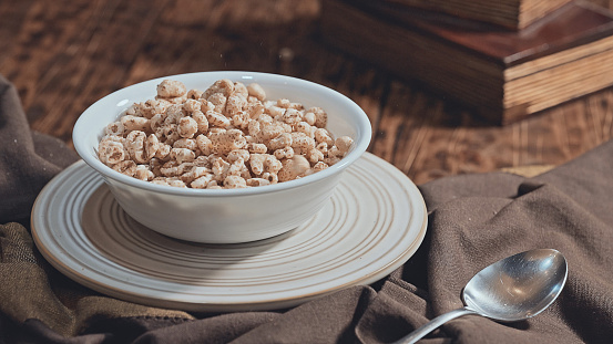 Puffed wheat cereal in a bowl with milk