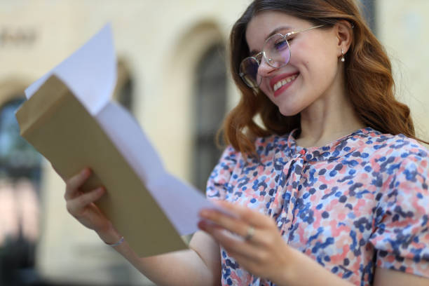 istock A young woman reading letter or document. 1668352661